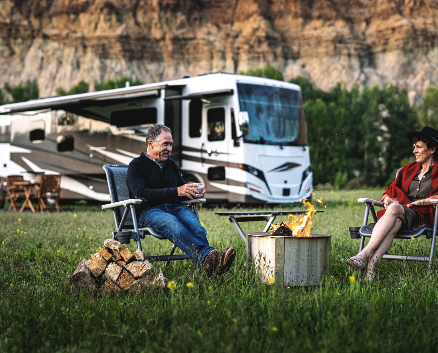 A couple camping with a Tiffin motorhome