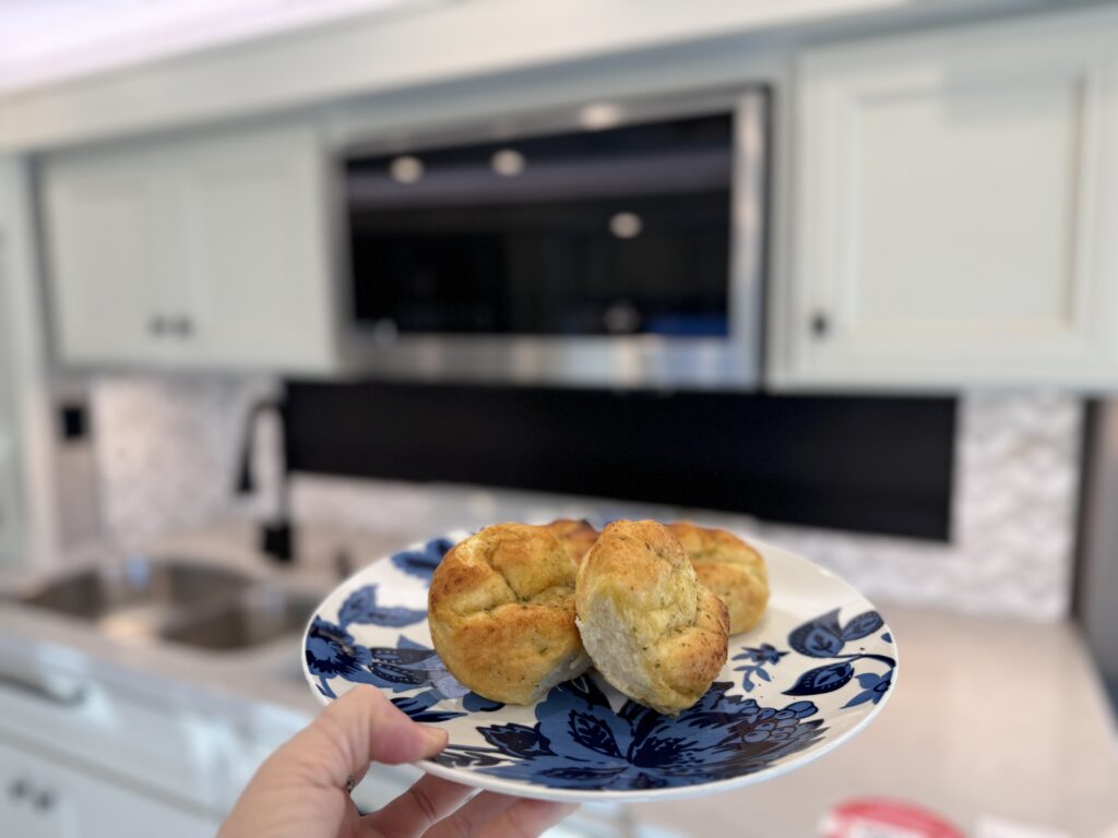 Cooked rolls in front of convection microwave oven